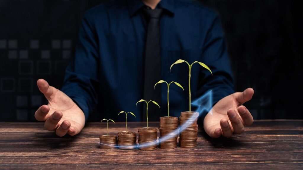 Business growth concept with stacked coins sprouting plants and upward arrow, symbolizing investment success and financial progress